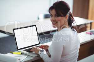 Mature student using laptop