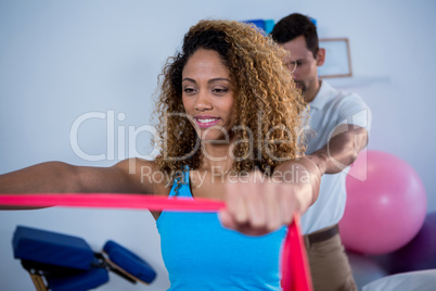 Physiotherapist giving shoulder massage to patient