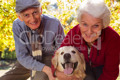Elderly couple with their pet dog