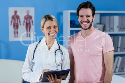 Portrait of physiotherapist and male patient