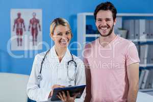 Portrait of physiotherapist and male patient