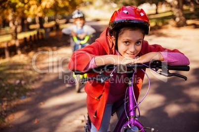 Portrait of smiling girl with mountain bike