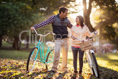 Full length of couple with bicycles