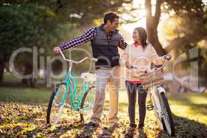 Full length of couple with bicycles
