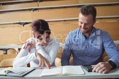 Mature students reading a book