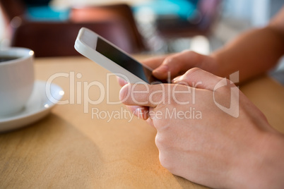 Close-up of hands using a mobile phone