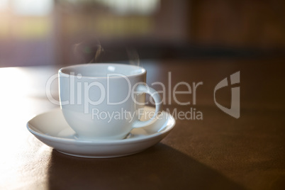 Coffee cup with saucer on a table