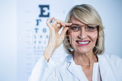 Smiling female optometrist wearing spectacles