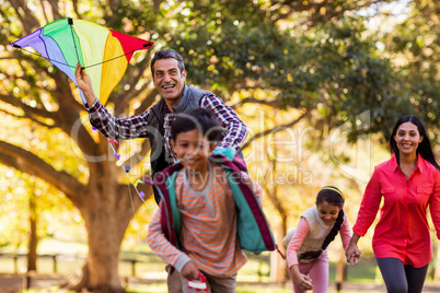 Happy family enjoying with kite