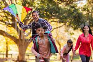 Happy family enjoying with kite