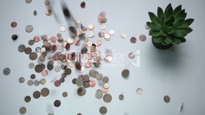 Vintage coins droping on the white table