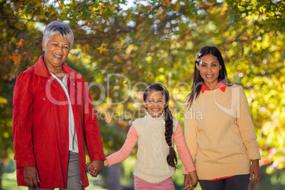 Happy daughter with mother and grandmother at park