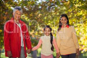 Happy daughter with mother and grandmother at park