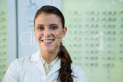 Optometrist smiling in optical store