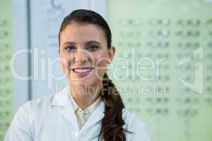 Optometrist smiling in optical store