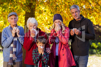 Sick family standing at park