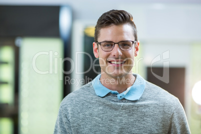 Smiling customer in optical store