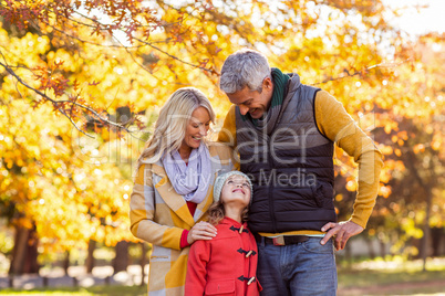 Smiling family at park during autumn