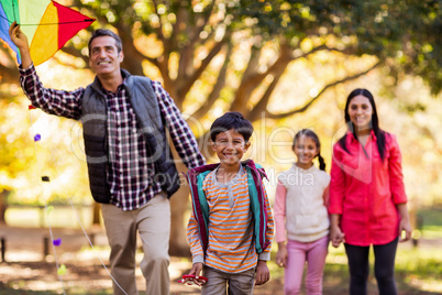 Happy family playing with kite