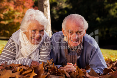 Senior couple lying on their stomach