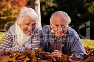 Senior couple lying on their stomach