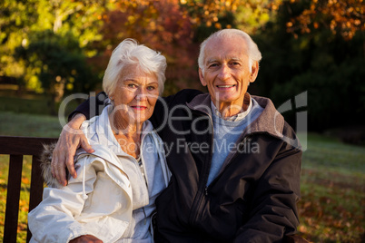 Elderly couple sitting on a bench