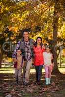 Portrait of smiling family walking at park