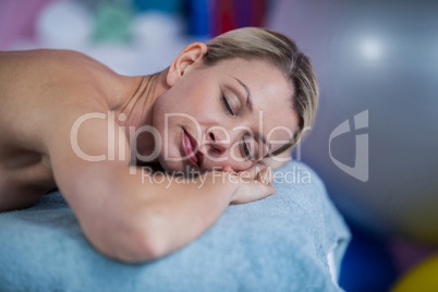 Beautiful woman lying on a massage bed