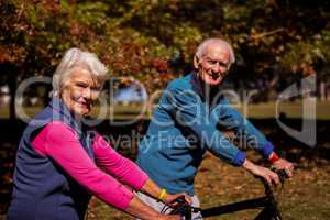 Elderly couple biking