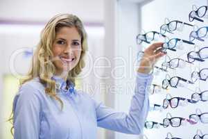 Female customer selecting spectacles