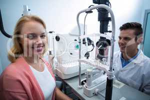 Portrait of female patient smiling in ophthalmology clinic