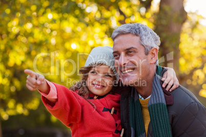 Happy daughter with father at park