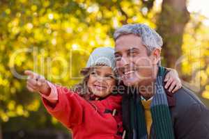 Happy daughter with father at park