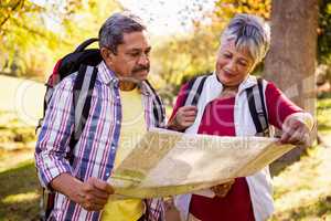 Mature couple looking a map