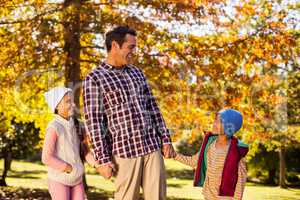 Happy father enjoying with children at park