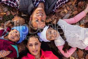 Overhead view of family forming huddle