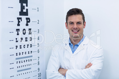 Optometrist standing in ophthalmology clinic