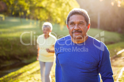 Mature man walking in a park