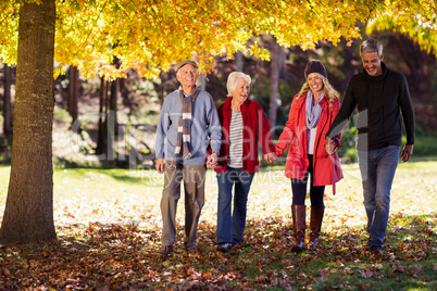 Happy family walking at park