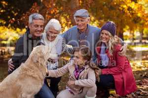 Happy family with dog at park