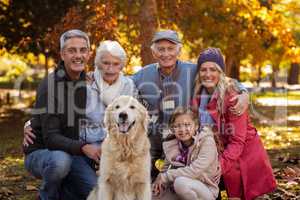 Multi-generation family with dog at park