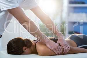 Woman receiving arm massage from physiotherapist
