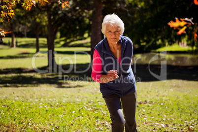 Elderly woman making jogging
