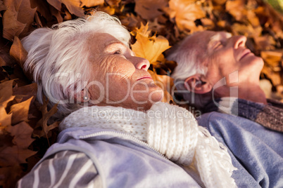 Senior couple sleeping on the ground