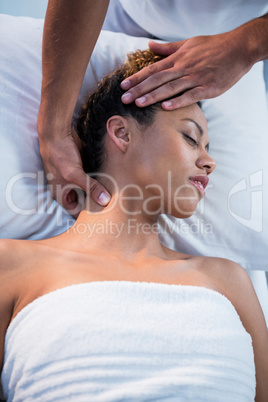 Woman receiving neck massage from physiotherapist