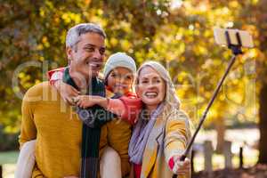 Smiling family taking selfie