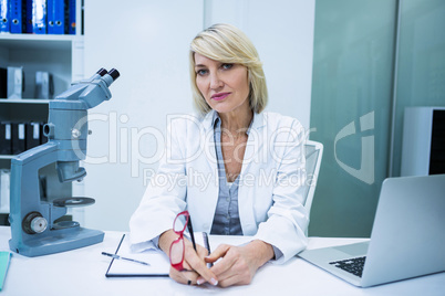 Optometrist sitting in ophthalmology clinic