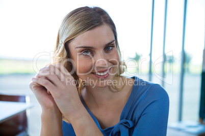 Smiling woman sitting in a coffee shop