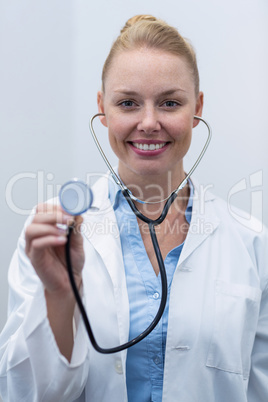 Close-up of female doctor holding stethoscope