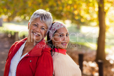 Portrait of mature mother with daughter at park